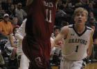 Olney senior forward Eli Johnson goes up for a shot against Graford