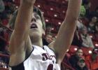 Olney High School sophomore forward Parker Mayers goes up for a jumper against Munday.