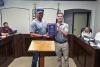 Olney Mayor Rue Rogers presents Public Utilities director Michael Jacoba with an award from the Texas Water Utilities Association at the June 23 Council meeting. Photo by Dale Lovett