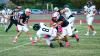 OHS Cub #52 Jacobi Esquivel DLOL brings down an Alvord Bulldog runner. Photo by Will Sadler