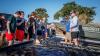 Wes Dutter (Right, grey shirt), a fishery biologist for the Texas Parks and Wildlife office in Wichita Falls, goes into detail about spawning beads, how they help lakes, as well as the different functions TPW offers, the day’s tasks.