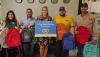Atmos Energy employees deliver backpacks to Olney Elementary School: (L-R): Pam Hughes Pak and Carlos Trevino, Assistant Principal Kalynn Philipp, Atmos Energy’s Riley Whitson and Trevor Whitsitt. Photo provided by Atmos Energy