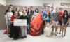 A representative of Carter BloodCare came to Olney High School Wednesday, Sept. 23, to present the National Honor Society with a $500 check. Pictured with the donation are (front, L-R) Braelyn Casteel, Jordynn Petty, Maddox Johnson (as Buddy the Blood Dro